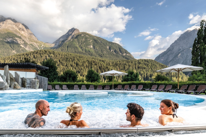 Bathing in the mineral bath Bogn Engiadina Scuol, Engadine