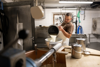 The alpine dairyman Marcel Adam making cheese.